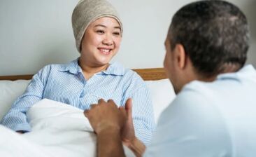 woman with cancer in bed